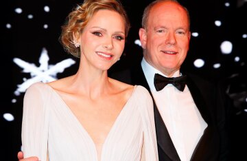 Princess Charlene of Monaco (in a low-cut dress) and Prince Albert II attended the Christmas ball.