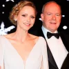 Princess Charlene of Monaco (in a low-cut dress) and Prince Albert II attended the Christmas ball.