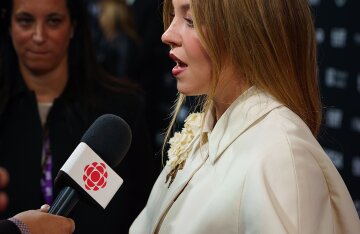 Sydney Sweeney posing on a red carpet at the 2024 Toronto International Film Festival
