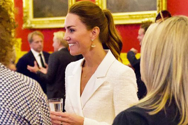 All in white: Kate Middleton at the presentation of her new photo project