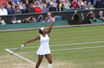 Serena Williams serving during a match at Wimbledon
