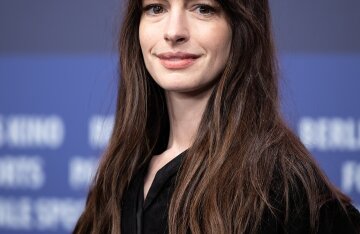 Anne Hathaway smiling at a public appearance
