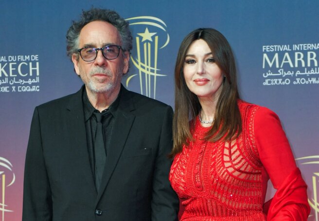 Monica Bellucci in a red jumpsuit and Tim Burton hit the red carpet at the Marrakech Film Festival again