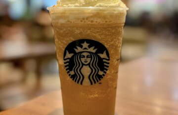 A Starbucks Frappuccino topped with whipped cream