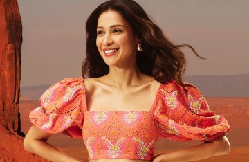 Ravshana Kurkova, wearing dresses with sacred symbols, posed for Oksana Lavrentyeva's brand.