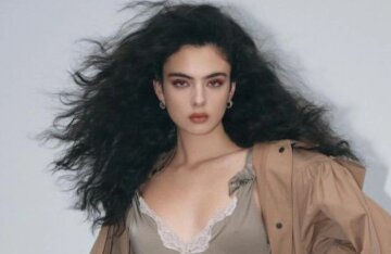 Deva Cassel, with a voluminous hairstyle and lace, posed for a glossy magazine