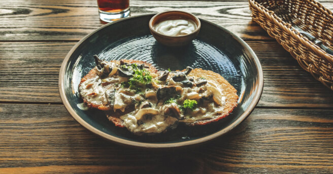 Delicious breakfast: potato pancakes with mushroom sauce