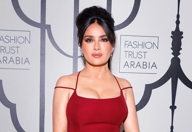 Salma Hayek steps out in a tight red dress and a bouffant hairstyle