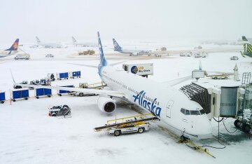 An Alaska Airlines Boeing 737 jet on the tarmac at Ted Stevens Anchorage International Airport.