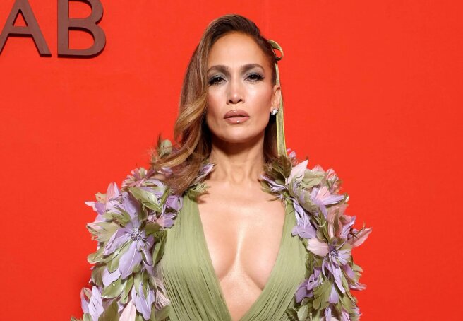 Cape with flowers and deep neckline: Jennifer Lopez attended the Elie Saab show in Paris