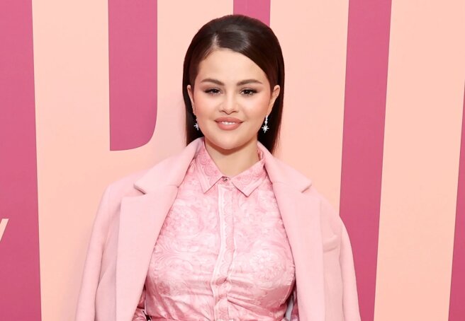 Selena Gomez wears pink at an event for her brand Rare Beauty