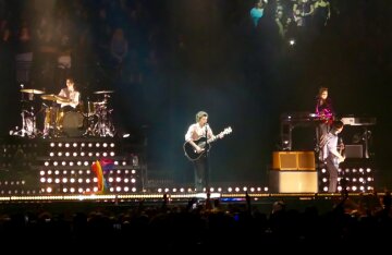 Harry Styles performing on stage in St. Paul, Minnesota