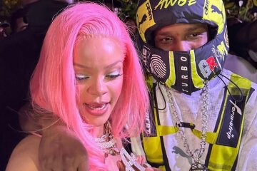 Rihanna in a black dress and pink hair supported A$AP Rocky at the opening of the new Puma F1 store