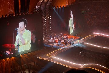 Harry Styles performing live on stage during his Together, Together tour