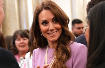 Kate Middleton wore a lilac dress to a reception in honor of Queen Elizabeth II's 100th birthday.