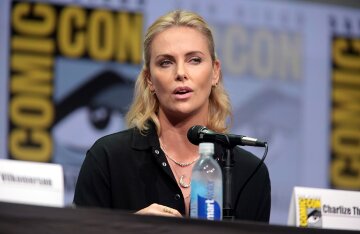 Charlize Theron smiling at an event