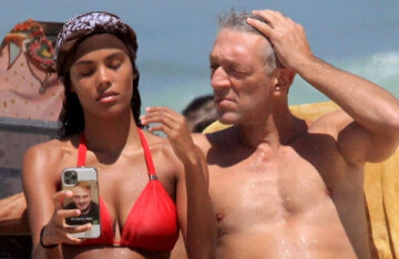 Tina Kunaki and Vincent Cassel on the beach in Brazil