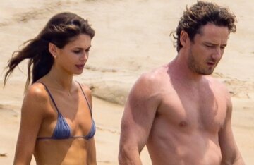 Cindy Crawford's daughter Kaia Gerber was photographed in a micro bikini while on vacation with her boyfriend.