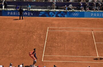 Carlos Alcaraz playing tennis at the 2024 Summer Olympics