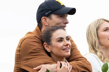 Ashton Kutcher and Mila Kunis at a music festival in London