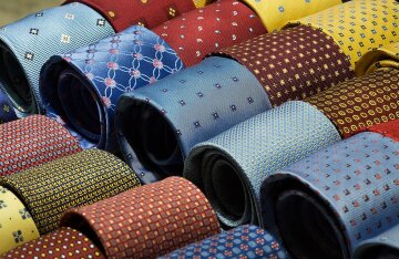 A rack of colorful patterned silk neckties