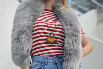 A person wearing a plush faux fur coat