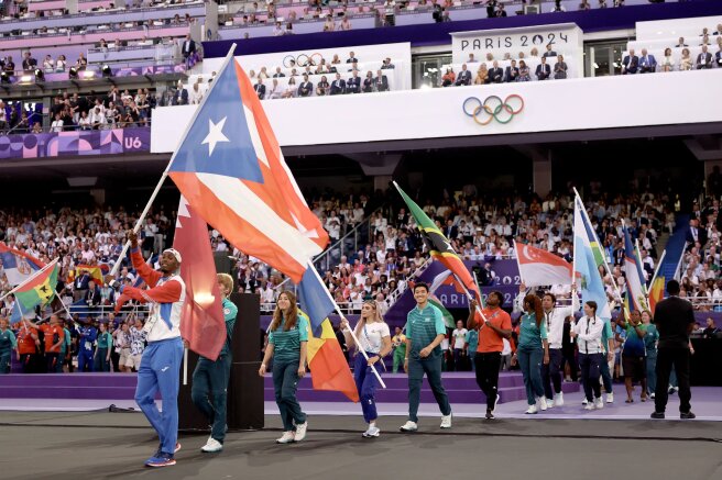 Спортсмены на церемонии закрытия/Фото: Jamie Squire/Getty Images