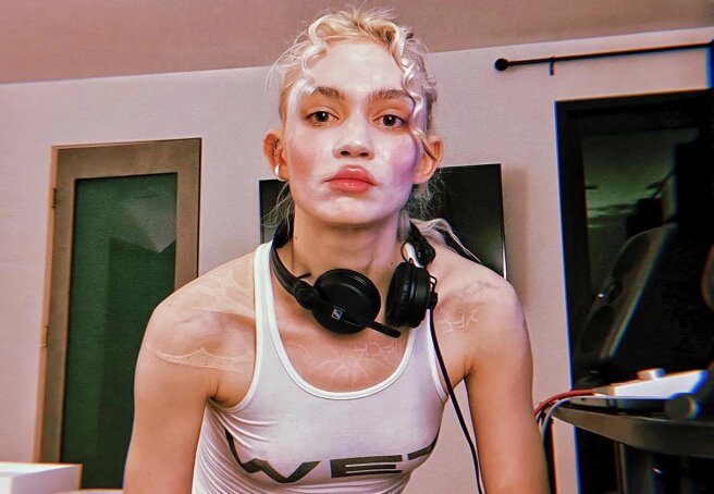 Grimes Says She 'Ran Away' From Elon Musk and Still Took Her Child