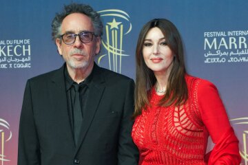 Monica Bellucci in a red jumpsuit and Tim Burton hit the red carpet at the Marrakech Film Festival again