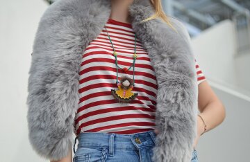 A person wearing a plush faux fur coat
