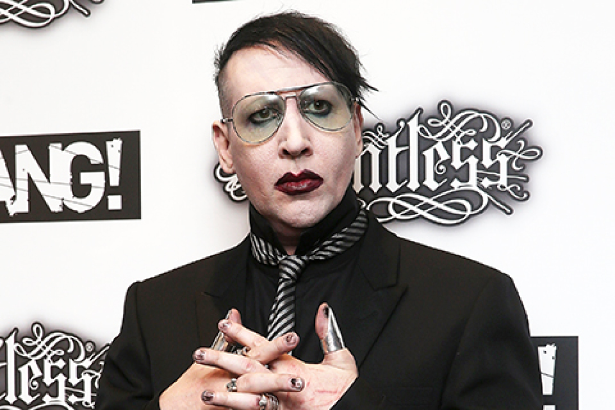 Police have issued an arrest warrant for Marilyn Manson. He faces a ...